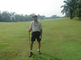 Standing on the course with Club
