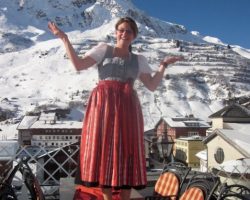In traditional Austrian dress, a Austrian hotel manager shows off her village of ZÃers, Austria Austria