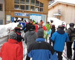 Skiers wait in the lift line at the Zug chairlift in the Arlberg Austria