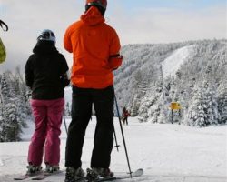 Skiers atop the gondola station view the upper Straight Brook area Skiers atop the gondola station view the upper Straight Brook area