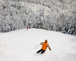 A skier skis from Gore Mountains summit in North Creek, NY A skier skis from Gore Mountains summit in North Creek, NY