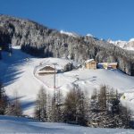 Gondolas form the setting in the mountain village of Corvara, part of the Sella Ronda tour Sella Ronda Gondolas