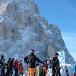 Skiers enjoy the beauty of the Dolomite on the Sella Ronda tour. Sella Ronda Skiers