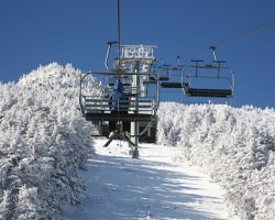 A Skier nears the top of the Summit Chair at Whiteface Mt. A Skier nears the top of the Summit Chair at Whiteface Mt.
