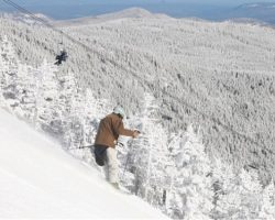 A skier descends on the Mens Downhill course from summit of Whiteface Mt. A skier descends on the Mens Downhill course from summit of Whiteface Mt.
