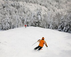 A skier skis from Gore Mountains summit in North Creek, NY A skier skis from Gore Mountains summit in North Creek, NY