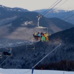 Skiers and Riders on North Peak Quad at Loon Mt. North Peak Quad