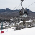 Loon Mt. Gondola near base with Loon Mountain Club ski in / ski out Hotel & resort background Loon Mountain Club ski in / ski out Hotel & resort