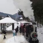 Skiers & riders arrive aboard Loons Steam train at base area RR station at Loon. The 1934 circa train hauls skiers and tourists between base areas at Loon Mt Loon Mountain Steam Train