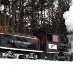 John Henry Steam engine at Loon Mt. The wood fired steam train hauls skiers and riders between base areas at Loon John Henry Steam engine at Loon Mountain