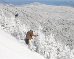 A skier descends on the Mens Downhill course from summit of Whiteface Mt. A skier descends on the Mens Downhill course from summit of Whiteface Mt.