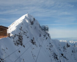 Hintertux Summit Gondola Passes a Massive Rock Cut on its way to the Station